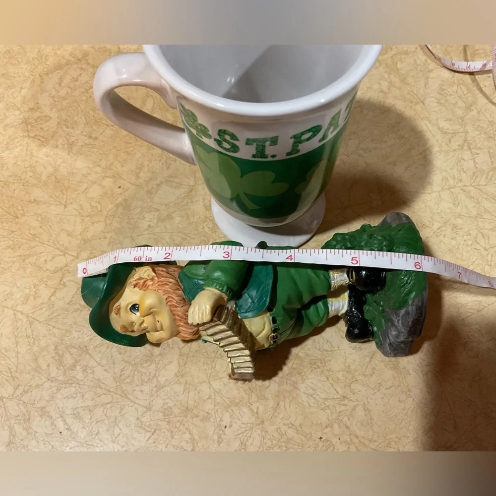 St. Patrick’s Day: mug, leprechaun, ngold plated/tone bracelet with green stone.